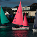Green, Purple and Pink Access 303 Dinghies sailing in Carrickfergus Harbour