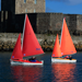 Red and Orange Access 303 Dinghies sailing in Carrickfergus Harbour