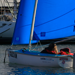 Light Blue Access 303 Dinghy sailing in Carrickfergus Harbour