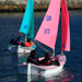 Pink and Green Access 303 Dinghies Sailing in Carrickfergus Harbour
