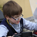 One of our young volunteers sitting on one of the motorbikes