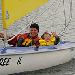 Dark blue Access 303 Dinghy sailing in Carrickfergus Harbour